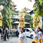 Balinese women bring offering in front of bali direct store pererenan