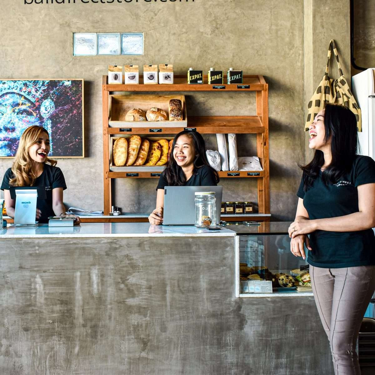 3 women having a fun conversation in Bali Direct Store Pererenan